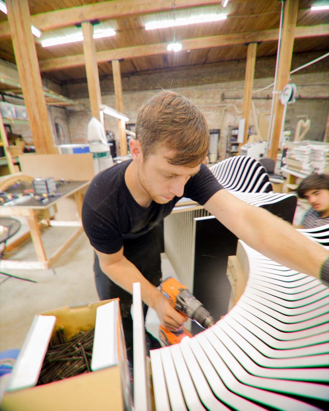 Kyle assembling a WAVES bench by hand